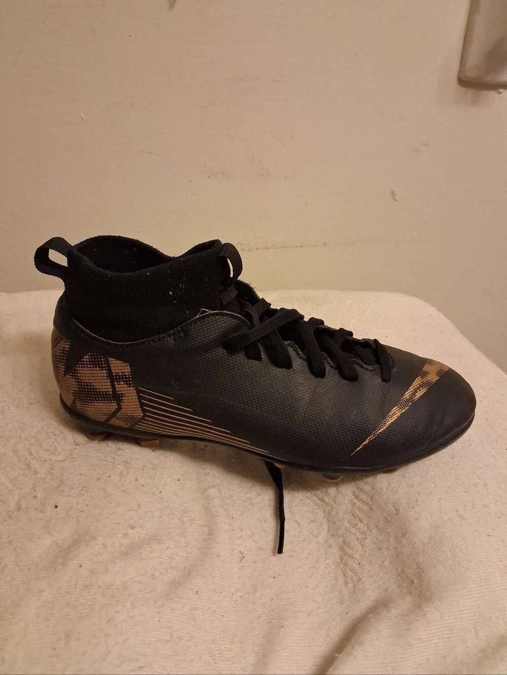 Youth Nike Black Cleats with Gold Swoosh Size 5Y